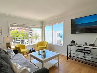 a living room with a couch and a table at Ocean View Hideaway Unit #3 in San Clemente