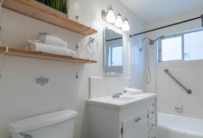 a bathroom with a white toilet and a sink at Sea View Escape Unit #2 in San Clemente