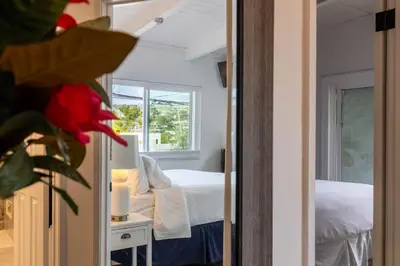 a room with a bedroom with a bed and a window at Bright Ocean View Escape Unit #1 in San Clemente