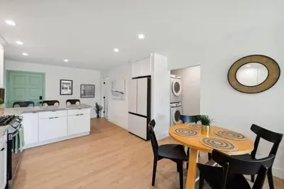 a kitchen and dining room with a table and chairs at Coastal Living at its Finest Pacific Beach in San Diego