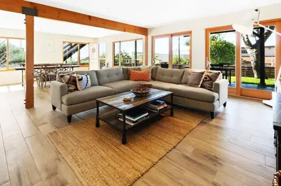 a living room with a couch and a table at The Beachside Hideaway 3 blocks From The Beach! in Encinitas