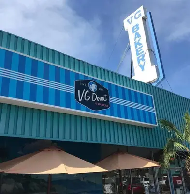 a restaurant with two umbrellas in front of a building at The Beachside Hideaway 3 blocks From The Beach! in Encinitas