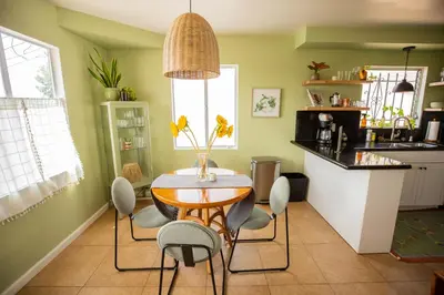 a kitchen with a table and chairs in a kitchen at Cozy Home with Downtown View in San Diego