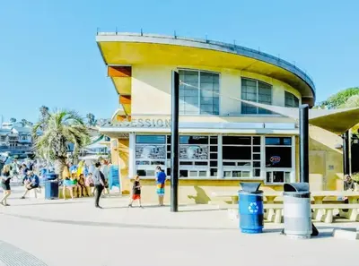 a building with people walking in front of it at Coastal Paradise Blocks from Beacon's Beach in Encinitas