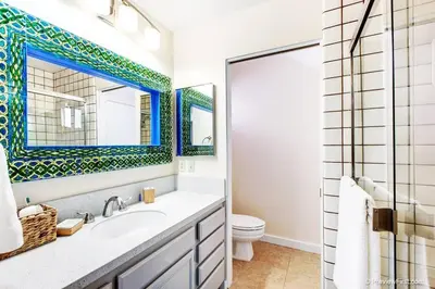a bathroom with a sink and a toilet at Coastal Paradise Blocks from Beacon's Beach in Encinitas