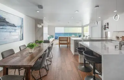 a kitchen and dining room with a table and chairs at Ocean Dreamin in Encinitas
