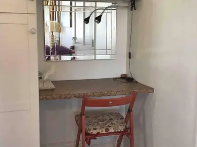 a chair sitting at a counter with a mirror at Min to Downtown/Beach/Parks Free Parking Sleep 3+ in San Diego