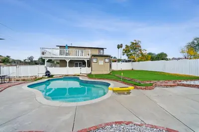 a backyard with a swimming pool and a house at Paradise On Earth residence in Lake Elsinore
