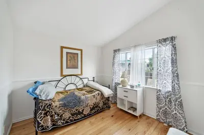 a bedroom with a bed and a window at Paradise On Earth residence in Lake Elsinore
