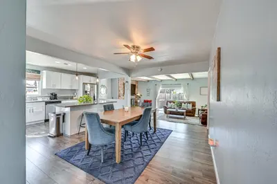a kitchen and dining room with a table and chairs at Walkable Chula Vista Home with Covered Patio in Chula Vista