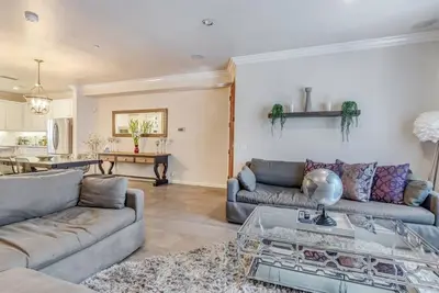a living room with two couches and a table at 4BR Spectacular Harbor View Modern Home 5min Zoo in San Diego