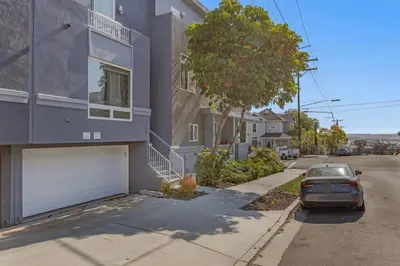 a car parked in front of a house at 4BR Spectacular Harbor View Modern Home 5min Zoo in San Diego