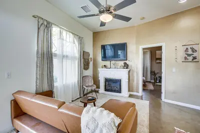 a living room with a couch and a fireplace at Cozy Alpine Cottage Near Casinos and Trails! in Alpine