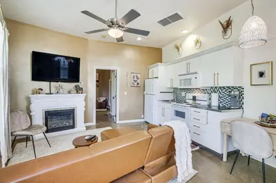 a living room with a couch and a fireplace at Cozy Alpine Cottage Near Casinos and Trails! in Alpine