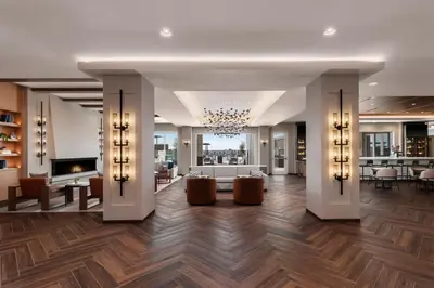 a lobby of a hotel with a chandelier at SpringHill Suites by Marriott Chula Vista Eastlake in Chula Vista