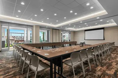 a large conference room with a long table and chairs at SpringHill Suites by Marriott Chula Vista Eastlake in Chula Vista