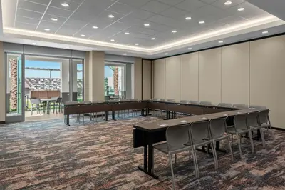 a conference room with a large table and chairs at SpringHill Suites by Marriott Chula Vista Eastlake in Chula Vista