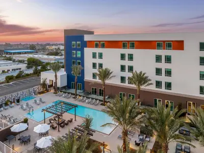 an overhead view of a hotel with a pool and palm trees at SpringHill Suites by Marriott Chula Vista Eastlake in Chula Vista