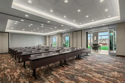 a large room with rows of tables and chairs at SpringHill Suites by Marriott Chula Vista Eastlake in Chula Vista