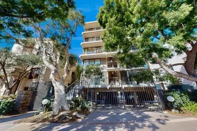 a building with trees in front of it at Seaside Serenity Haven -30 night min in San Diego