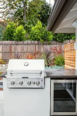 a white stove top oven sitting in a backyard at Amazing Views with Heated Pool and Jacuzzi Near Beach in Solana Beach