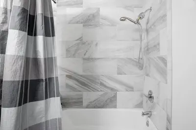 a shower in a bathroom with a shower curtain at Amazing Views with Heated Pool and Jacuzzi Near Beach in Solana Beach