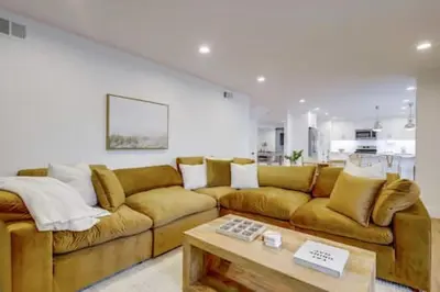 a living room with a couch and a coffee table at Pickleball Paradise by Rather Be Properties in Mission Viejo