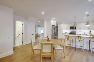 a kitchen and dining room with a table and chairs at Pickleball Paradise by Rather Be Properties in Mission Viejo