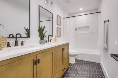 a bathroom with a sink and a tub and a toilet at Pickleball Paradise by Rather Be Properties in Mission Viejo