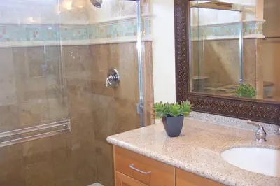 a bathroom with a shower and a sink at Amazing Location - Large and Luxurious 1 Bedroom Beach Condo By Beaches and Attractions in Solana Beach