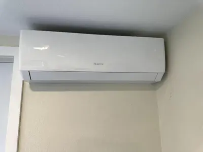 a white air conditioner hanging from a ceiling at Charming Guest House in SD in San Diego