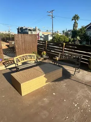 two benches sitting next to each other on a sidewalk at Guest House next to Little Italy in San Diego