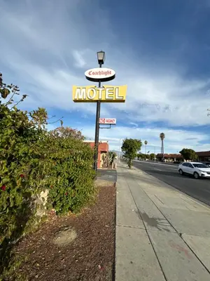 a motel sign on the side of a street at CoachLight Motel in Hemet