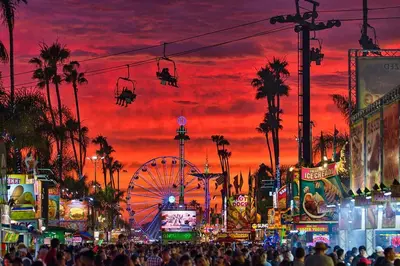 a crowd of people at a carnival at sunset at Sand Pebbles Resort - 1 Bedroom Condo in Great Location Right by the Beaches and Attractions in Solana Beach