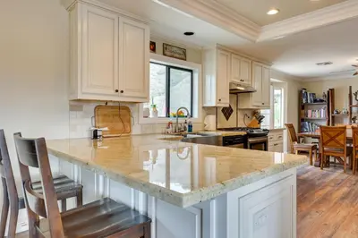 a kitchen with white cabinets and a counter top at Pet-Friendly Temecula Home in Wine Country! in Temecula