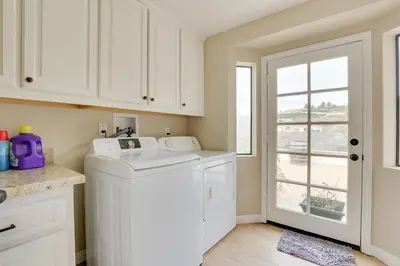 a white laundry room with a washer and dryer at Pet-Friendly Temecula Home in Wine Country! in Temecula
