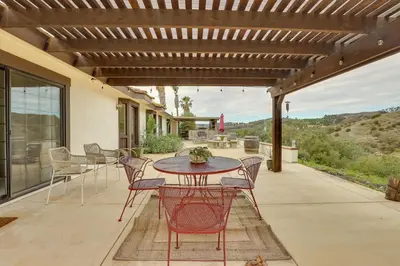 a patio with a table and chairs on a porch at Pet-Friendly Temecula Home in Wine Country! in Temecula