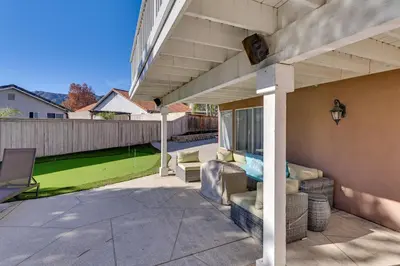 a patio of a house with a lawn at Lake Elsinore Home with Pool - 44 Mi to Disneyland! in Lake Elsinore