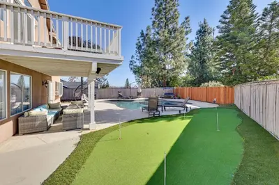 a yard with a green lawn with golf balls on it at Lake Elsinore Home with Pool - 44 Mi to Disneyland! in Lake Elsinore