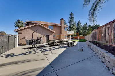 a house being built with a trailer in the driveway at Lake Elsinore Home with Pool - 44 Mi to Disneyland! in Lake Elsinore