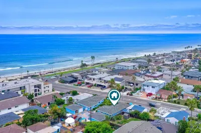 an aerial view of a city and the ocean at Walk To Beach - EV Charger - Outdoor Dining - 2BR in Carlsbad
