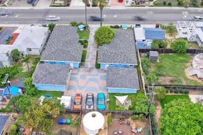 an overhead view of a row of houses with parked cars at Walk To Beach - EV Charger - Outdoor Dining - 2BR in Carlsbad
