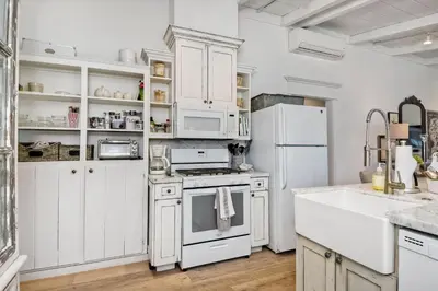 a kitchen with white appliances and white cabinets at Walk To Beach & Village - 5 Bedrooms - 3 Units in Carlsbad