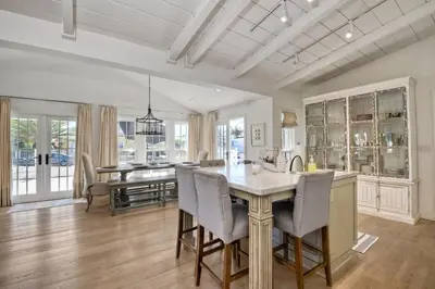 a kitchen and dining room with a table and chairs at Walk To Beach & Village - 5 Bedrooms - 3 Units in Carlsbad