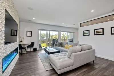 a living room with a couch and a fireplace at La Costa Luxury Condo - Fully Remodeled in Encinitas