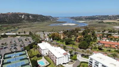 an aerial view of a city with a river and buildings at Private Balcony Overlooking Pool - Gated Parking in Encinitas