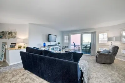 a living room with two couches and a tv at Ocean View, Pool, Hot Tub, Steps To Pier, Gated in Oceanside