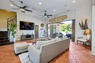 a living room with couches and a ceiling fan at Walk To The Beach - Outdoor Dining - Spacious in Carlsbad