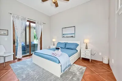 a bedroom with a bed and a window at Walk To The Beach - Outdoor Dining - Spacious in Carlsbad