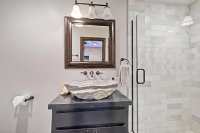 a bathroom with a sink and a mirror at Walk To The Beach - Outdoor Dining - Spacious in Carlsbad